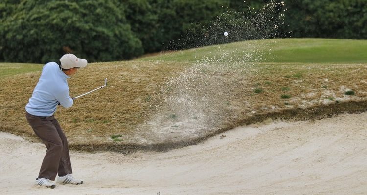 Man on putting green