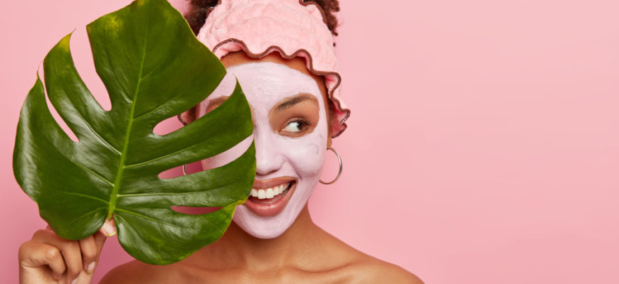 Cropped,Shot,Of,Happy,Young,Woman,Applies,Facial,Mud,Mask